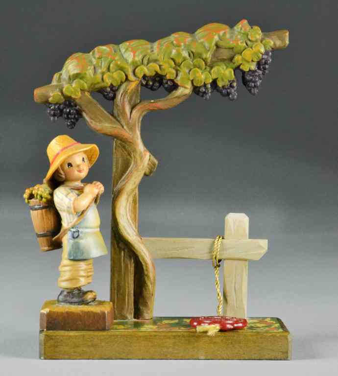 Appraisal: Anri Carved Wooden FigurinesTo include large grapevine sculptured stand ''''