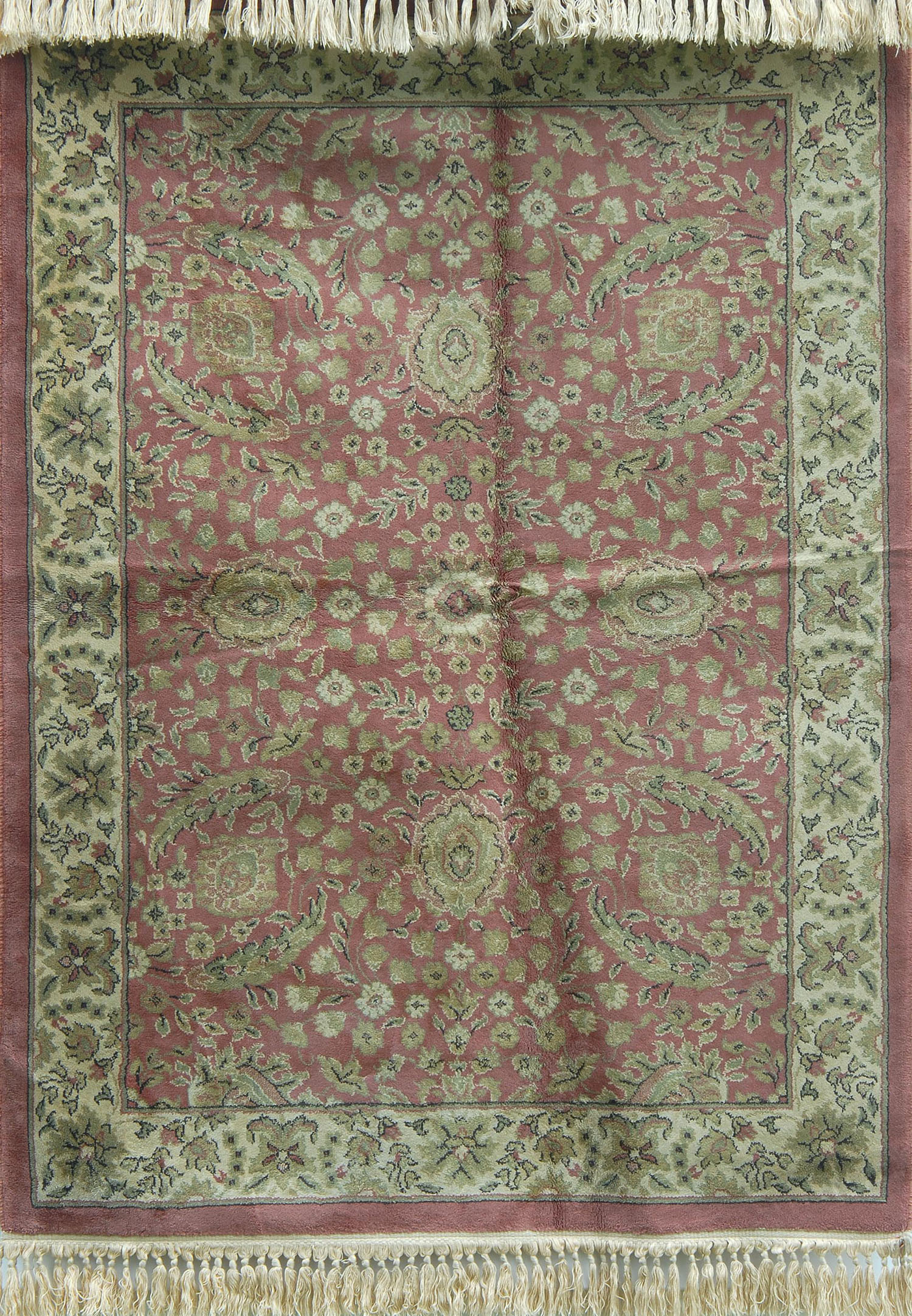 Appraisal: MACHINE-MADE CARPET IN A PERSIAN DESIGN ' x ' Rose-pink