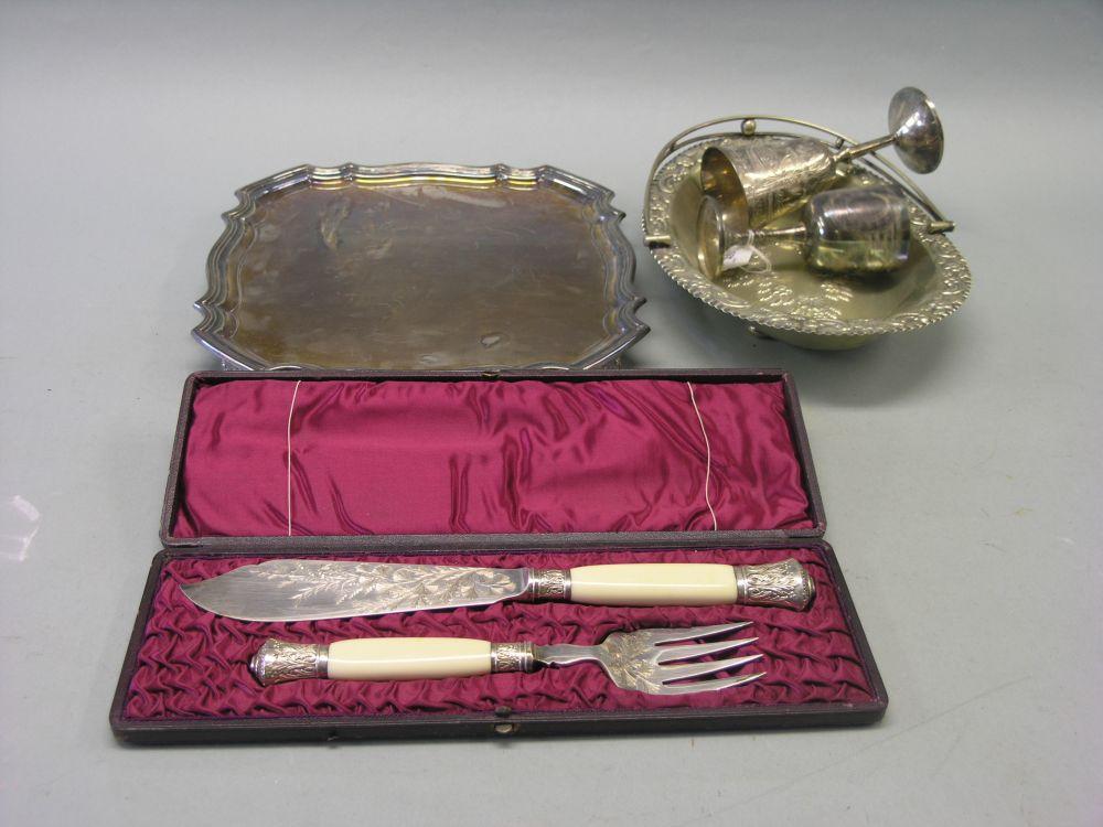 Appraisal: A pair of Victorian plated and engraved fish servers in