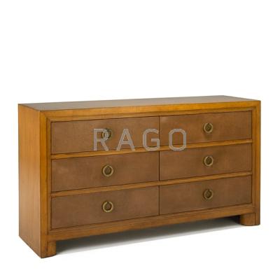 Appraisal: STYLE OF ROBSJOHN GIBBINGS Six-drawer dresser USA s Fruitwood leather