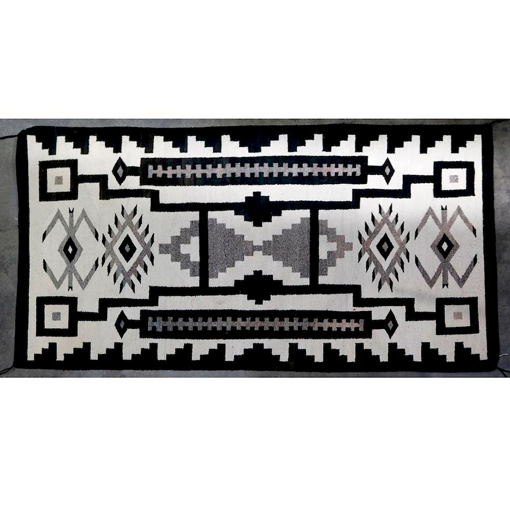 Appraisal: Navajo rug Navajo storm-pattern rug Approximately x