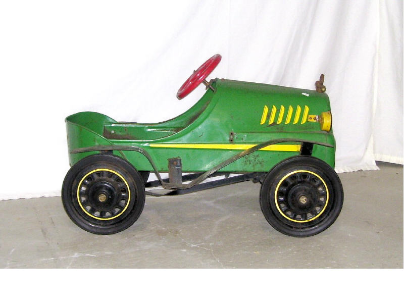 Appraisal: Roadster Pedal Car Originial green red and yellow paint Rubber