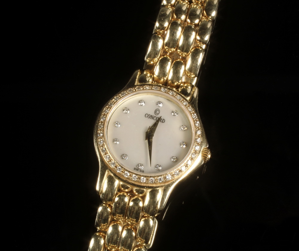 Appraisal: LADY'S WRISTWATCH - Concord K Yellow Gold Wristwatch with round