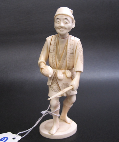 Appraisal: A JAPANESE IVORY CARVED FIGURE OF A FARMER carrying planting