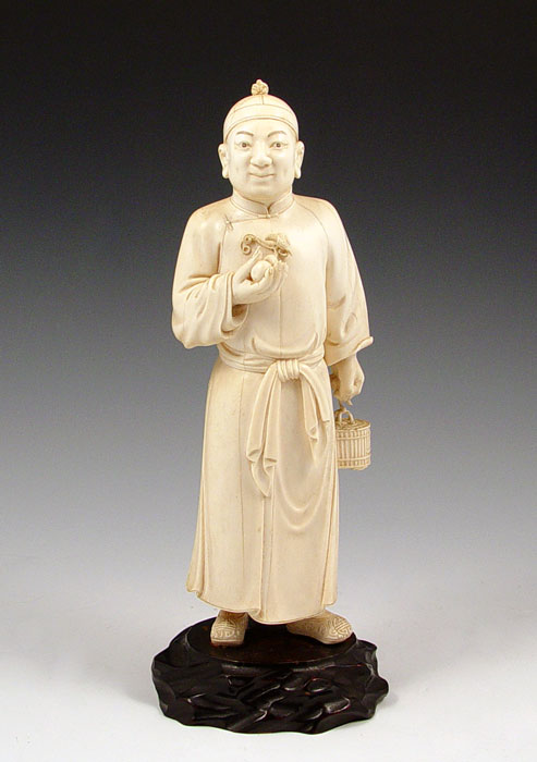 Appraisal: CHINESE CARVED IVORY FIGURE OF A MAN WITH BIRD AND