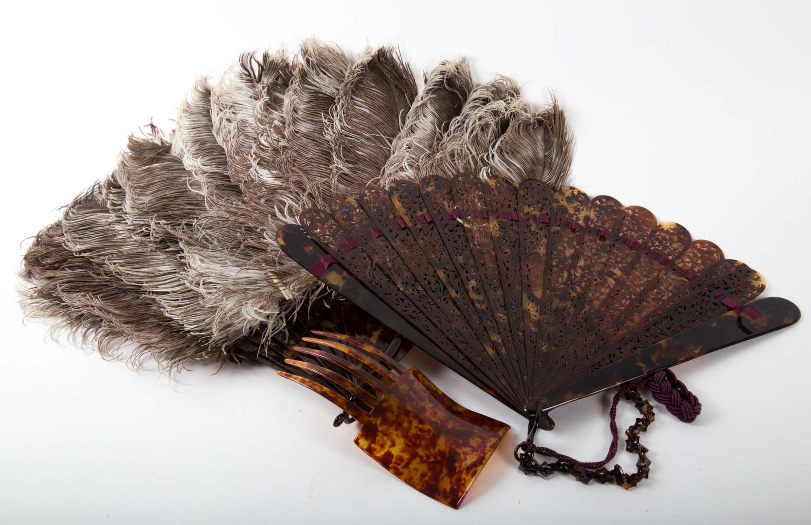 Appraisal: Two Edwardian tortoiseshell fans and hair comb circa fan with