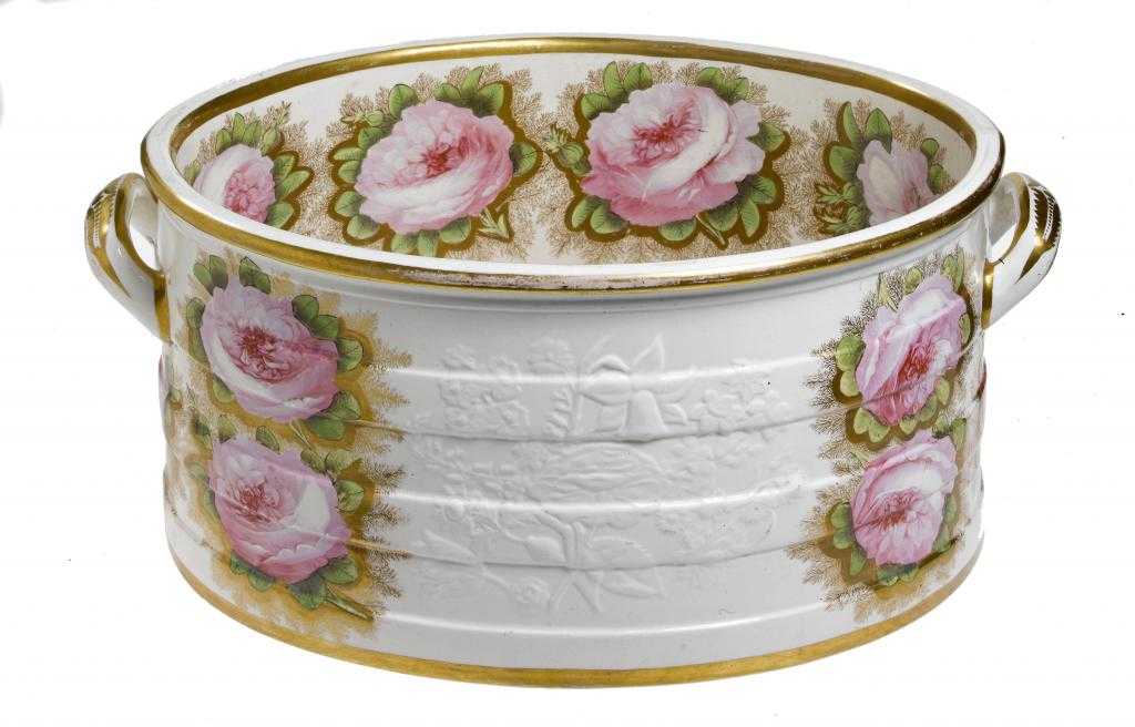 Appraisal: A SPODE EARTHENWARE FOOTBATH moulded with flowers and boldly painted