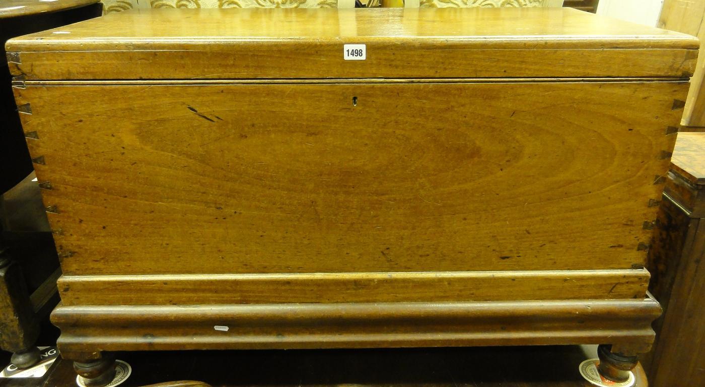 Appraisal: A th century mahogany blanket box with brass carrying handles