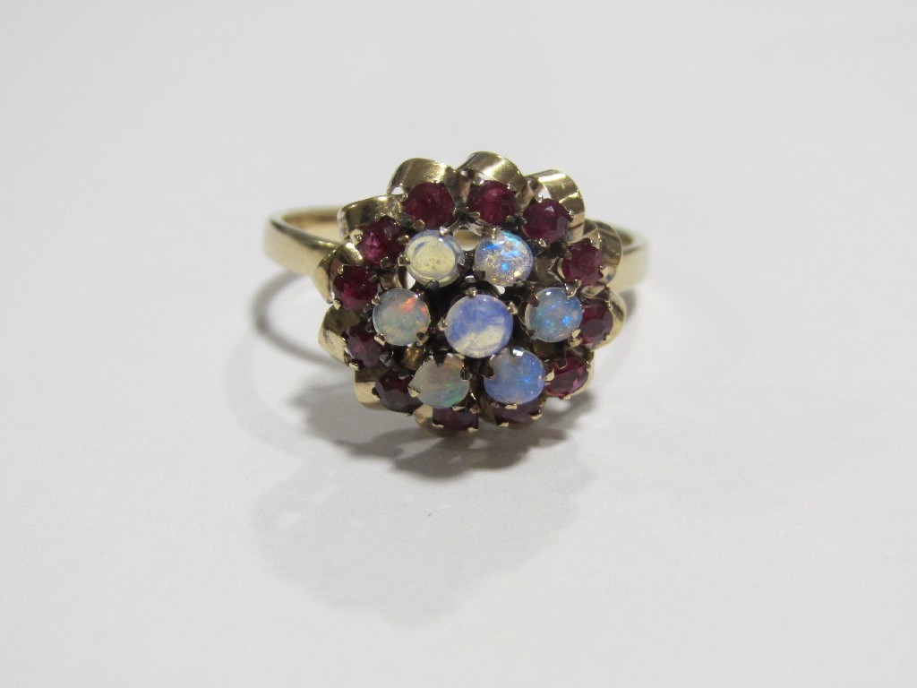 Appraisal: Eighteen carat gold opal and ruby cluster ring