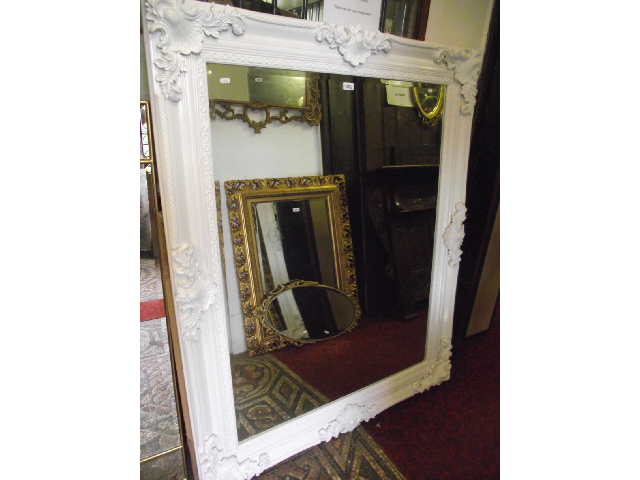 Appraisal: A large contemporary but antique style wall mirror of rectangular