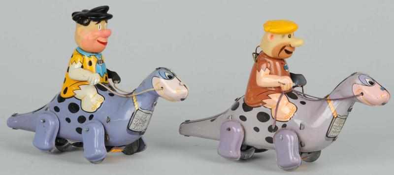 Appraisal: Lot of Tin Marx Flintstones Wind-Up Toys Description American Working