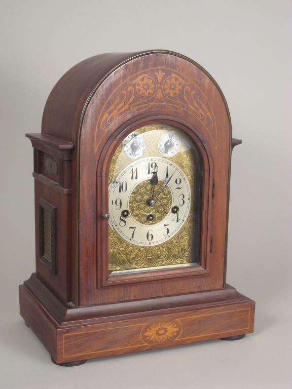 Appraisal: A late Victorian Bracket Clock with arched dial silvered chapter