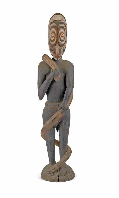 Appraisal: New Guinea carved and painted wood figure draped with a