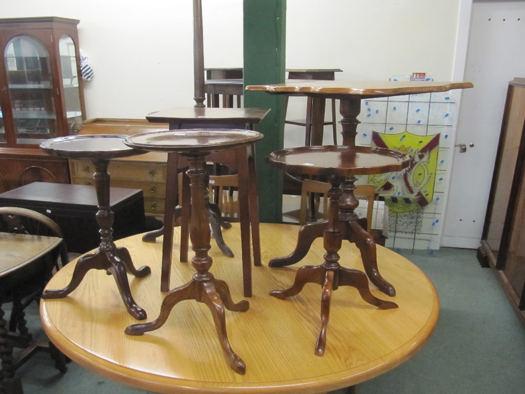 Appraisal: Late Victorian tripod table with snap top three wine tables