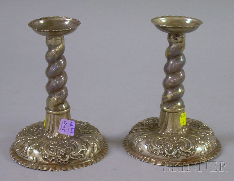 Appraisal: Pair of Baroque-style Candlesticks twisted throat over floral decorated base