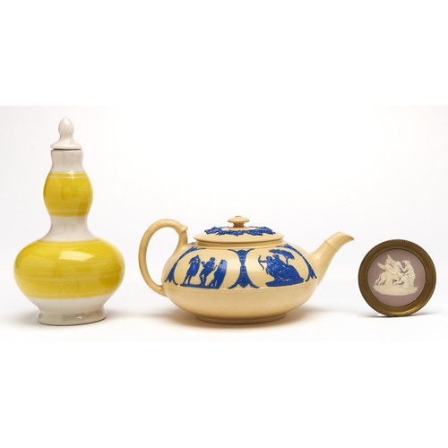 Appraisal: A Wedgwood smear glazed cane coloured earthenware teapot and cover