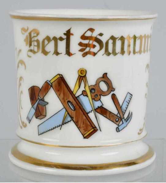 Appraisal: Carpenter s Tools Shaving Mug Description Gilt name Bert Samm