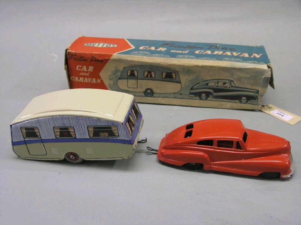 Appraisal: A Mettoy car and caravan set red plastic car with