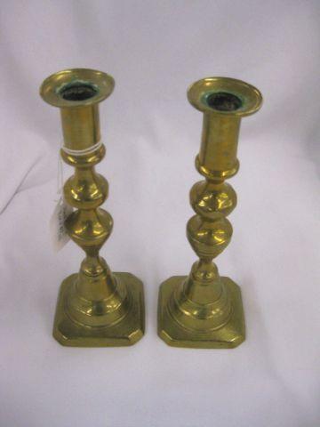 Appraisal: Pair of Brass Push-Up Candlesticks th century beehive style