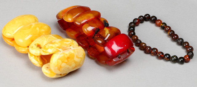 Appraisal: A LIGHT EGG YOLK AMBER BEAD BRACELET in panel form