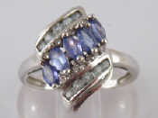 Appraisal: A carat white gold aquamarine and tanzanite ring size R