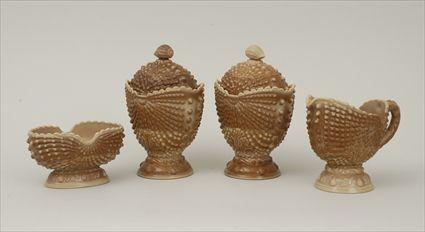 Appraisal: Caramel Slag Glass Shell-Form Pair of Jars and Covers a