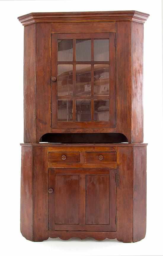 Appraisal: Cherry double corner cupboard North Carolina th century molded canted