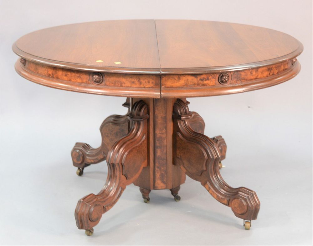 Appraisal: Victorian round walnut table carved pedestal base four leaves ht