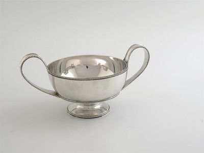 Appraisal: A George III bowl with beaded loop handles and border