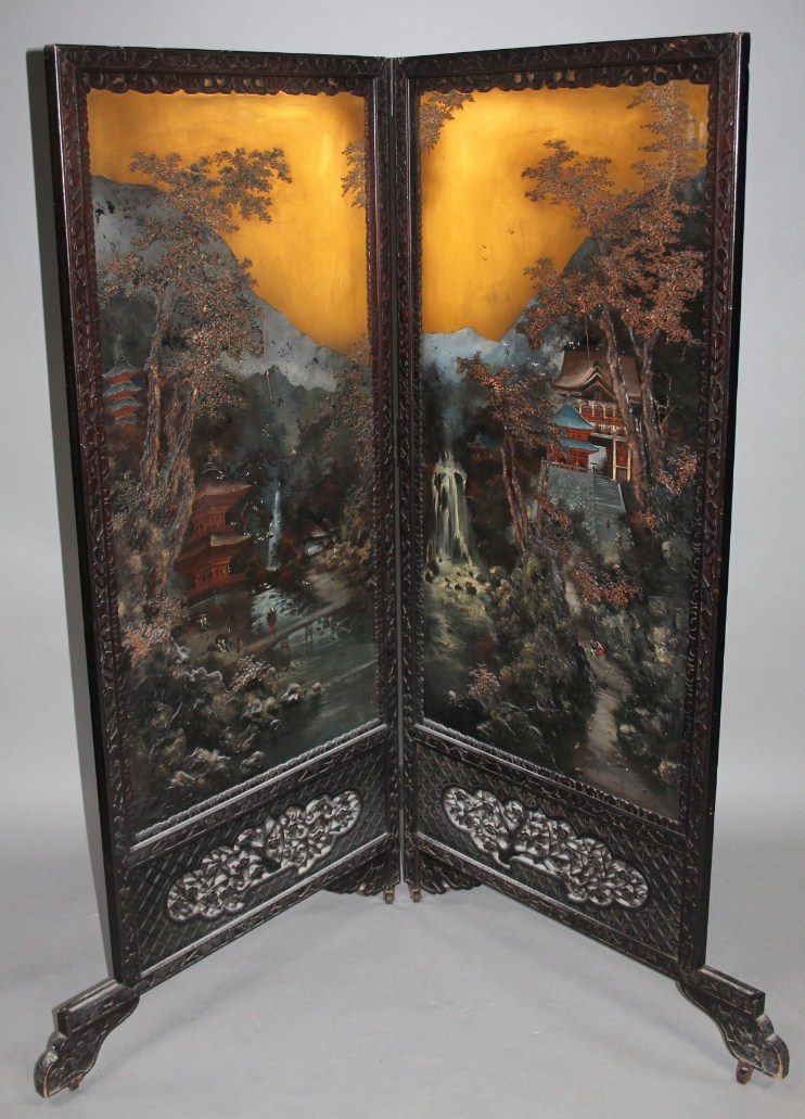 Appraisal: A Chinese hardwood two fold dividing screen decorated and raised