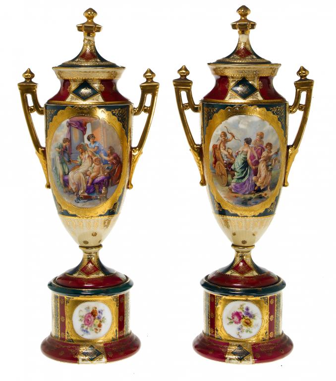 Appraisal: A PAIR OF VIENNA STYLE CLARET GROUND VASES AND COVERS