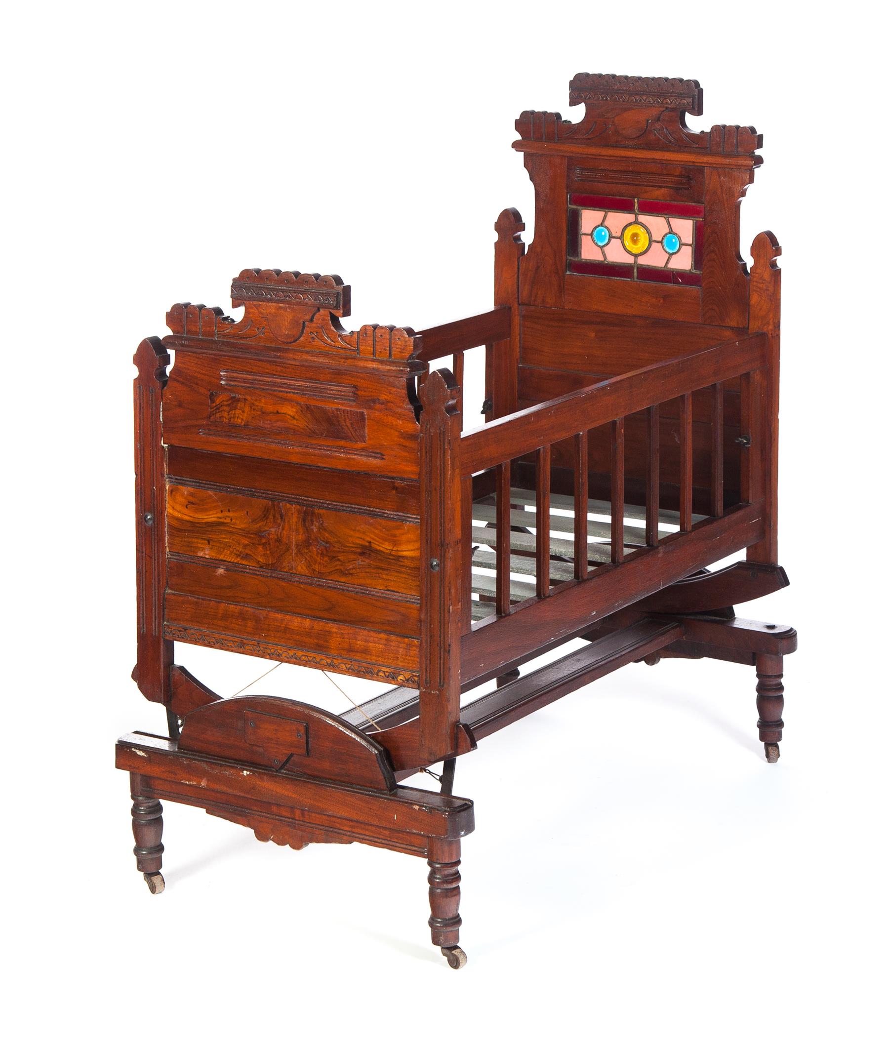 Appraisal: EASTLAKE VICTORIAN CRADLE American th quarter- th century walnut Scallop