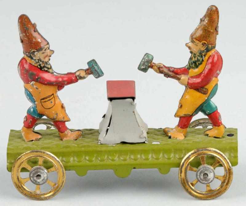 Appraisal: Tin Litho Gnomes Hammering Anvil Penny Toy Description German On