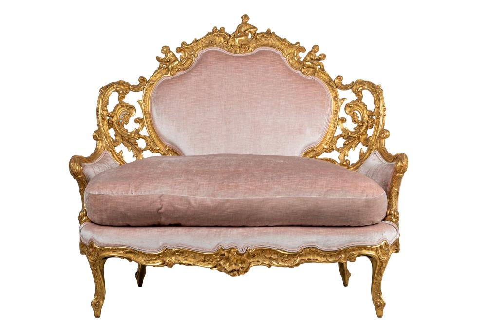 Appraisal: ITALIAN ROCOCO STYLE GILTWOOD SETTEEcovered with pink velvet inches wide