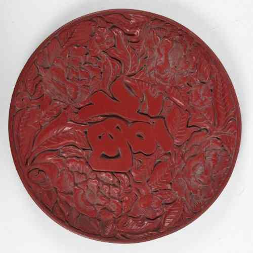 Appraisal: A Chinese cinnabar lacquer circular dish circular with carved character