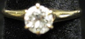 Appraisal: karat gold and diamond solitaire ringRound brilliant cut diamond prong