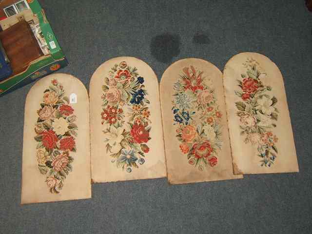 Appraisal: A SET OF FOUR FLORAL NEEDLEWORK ARCHING PANELS high x