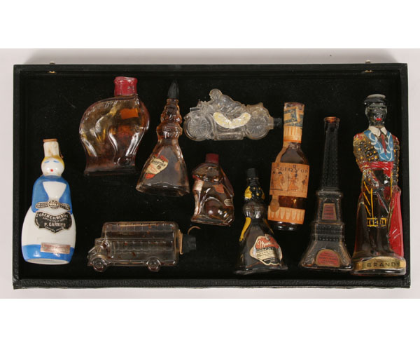 Appraisal: Nine figural bottles including Eiffel Tower matador double decker bus