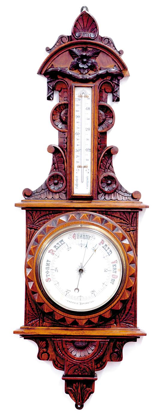 Appraisal: Continental carved oak barometer circa wall-hanging barometer and thermometer mounted