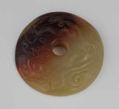 Appraisal: A Chinese Carved Jade Disk With Red Dragon Yellow green