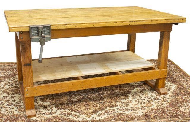 Appraisal: Rustic craftsman's workbench having rectangular top with dog holes iron