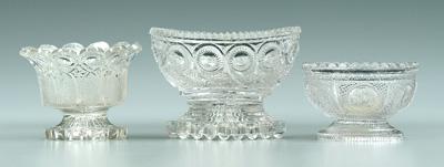 Appraisal: Three Sandwich glass salts clear pedestal type one circular with