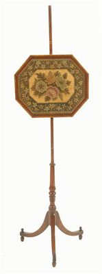 Appraisal: A th century mahogany pole firescreen the floral needlework panel