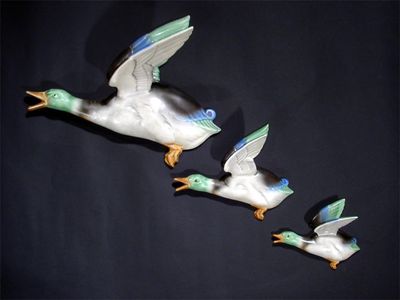 Appraisal: A set of three Poole Pottery graduated flying duck wall