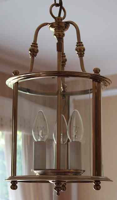 Appraisal: A GEORGIAN STYLE CYLINDRICAL BRASS AND THREE LIGHT HALL LANTERN