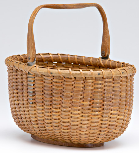 Appraisal: NANTUCKET RATTAN Mitchell Ray oval swing-arm basket ca - Partial