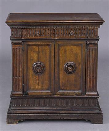 Appraisal: FLORENTINE BAROQUE CARVED WALNUT CREDENZA The molded top above fluted