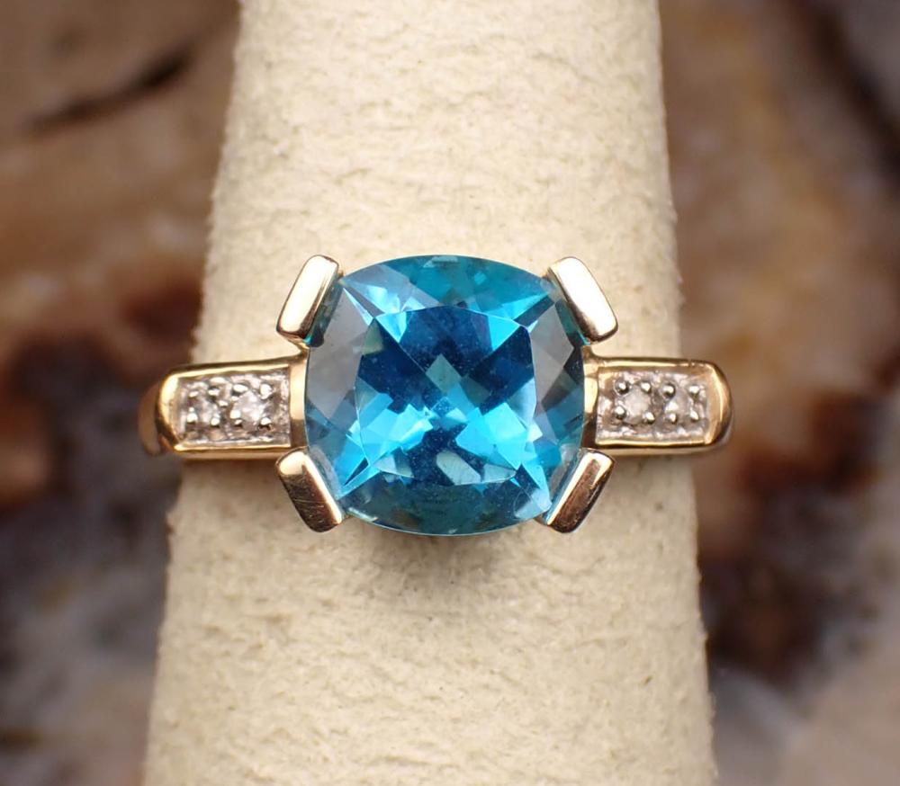 Appraisal: BLUE TOPAZ DIAMOND AND FOURTEEN KARAT GOLD RING The yellow