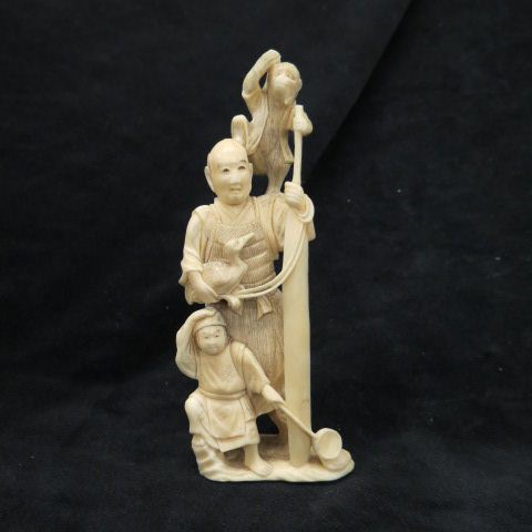 Appraisal: Chinese Carved Ivory Figurinewith man child man holding a duck