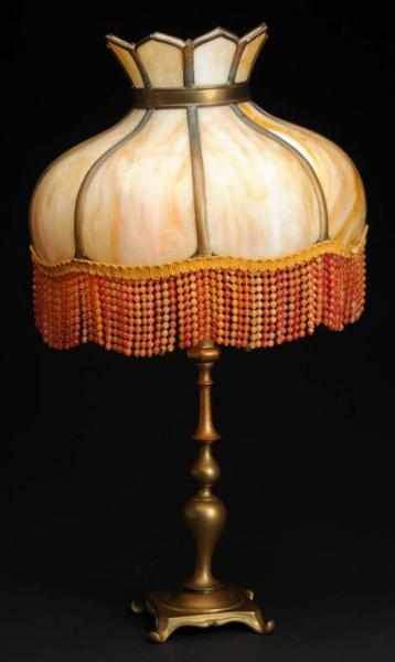 Appraisal: Victorian Slag Glass Lamp Description diameter shade on brass base